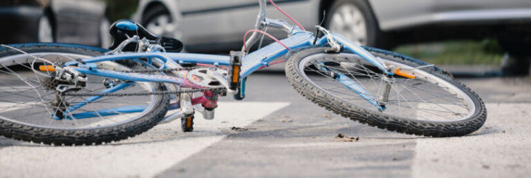 bicycle turned over after a crash in the road.