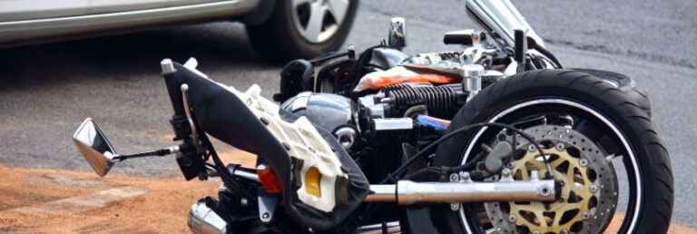 motorcycle turned over in road after an accident