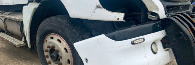 semi truck with bumper falling off