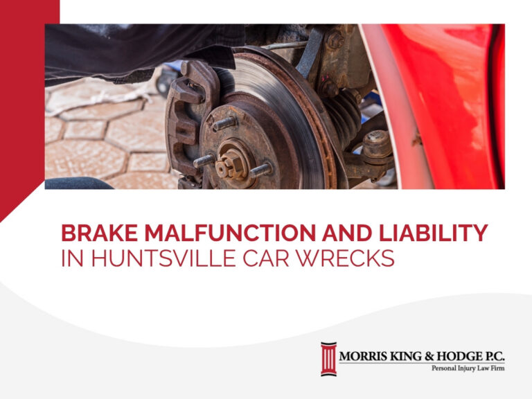 An exposed break to a car wheel with a red fender